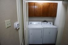 View of the laundry room. Washer and dryer are included. Programmable thermostat for heat/AC.

Filename: SRM_20101228_17514956.JPG
Aperture: f/2.8
Shutter Speed: 1/60
Body: Canon EOS-1D Mark II
Lens: Canon EF 16-35mm f/2.8 L