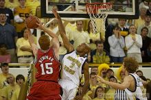 Jarrett Jack tries to block a shot at the UGA game.  Men's Basketball Georgia Tech beat UGA 87-49.

Filename: crw_5920_std.jpg
Aperture: f/2.8
Shutter Speed: 1/640
Body: Canon EOS DIGITAL REBEL
Lens: Canon EF 80-200mm f/2.8 L