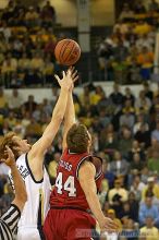 Luke Schenscher tipping off against UGA.  Men's Basketball Georgia Tech beat UGA 87-49.

Filename: crw_5913_std.jpg
Aperture: f/2.8
Shutter Speed: 1/640
Body: Canon EOS DIGITAL REBEL
Lens: Canon EF 80-200mm f/2.8 L