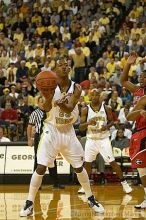 Anthony McHenry passes the ball.  Men's Basketball Georgia Tech beat UGA 87-49.

Filename: crw_5934_std.jpg
Aperture: f/2.8
Shutter Speed: 1/640
Body: Canon EOS DIGITAL REBEL
Lens: Canon EF 80-200mm f/2.8 L