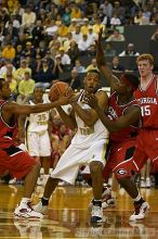 B.J. Elder fends off two UGA defenders.  Men's Basketball Georgia Tech beat UGA 87-49.

Filename: crw_5970_std.jpg
Aperture: f/2.8
Shutter Speed: 1/640
Body: Canon EOS DIGITAL REBEL
Lens: Canon EF 80-200mm f/2.8 L