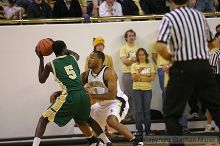 BJ Elder plays defense on LeMoyne at the men's basketball game.                                                                                                                                                                                                

Filename: img_4176_std.jpg
Aperture: f/2.8
Shutter Speed: 1/500
Body: Canon EOS DIGITAL REBEL
Lens: Canon EF 80-200mm f/2.8 L