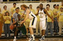 Luke Schenscher and Isma'il Muhammad play defense on LeMoyne at the men's basketball game.                                                                                                                                                                     

Filename: img_4132_std.jpg
Aperture: f/2.8
Shutter Speed: 1/500
Body: Canon EOS DIGITAL REBEL
Lens: Canon EF 80-200mm f/2.8 L