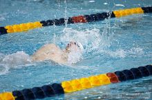 Jeremy Raines competes against the University of Tennessee in the backstroke.

Filename: crw_2224_std.jpg
Aperture: f/2.8
Shutter Speed: 1/640
Body: Canon EOS DIGITAL REBEL
Lens: Canon EF 80-200mm f/2.8 L