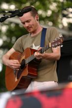 Damien Rice performs on the 99X stage on the second day of Music Midtown, 2004.

Filename: IMG_6328.jpg
Aperture: f/3.5
Shutter Speed: 1/320
Body: Canon EOS DIGITAL REBEL
Lens: Canon EF 80-200mm f/2.8 L