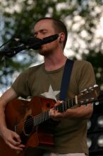 Damien Rice performs on the 99X stage on the second day of Music Midtown, 2004.

Filename: IMG_6316.jpg
Aperture: f/5.6
Shutter Speed: 1/320
Body: Canon EOS DIGITAL REBEL
Lens: Canon EF 80-200mm f/2.8 L