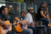 The Gene Pool, performing at the Austin airport.  Geno Stroia II on vocals/guitar, Jorge Castillo on vocals/guitar, Travis Woodard on drums and Steven Ray Will on vocals/bass guitar.

Filename: SRM_20060518_155544_0.jpg
Aperture: f/2.8
Shutter Speed: 1/250
Body: Canon EOS 20D
Lens: Canon EF 80-200mm f/2.8 L