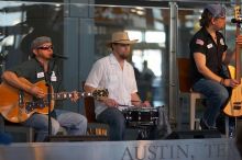 The Gene Pool, performing at the Austin airport.  Geno Stroia II on vocals/guitar, Jorge Castillo on vocals/guitar, Travis Woodard on drums and Steven Ray Will on vocals/bass guitar.

Filename: SRM_20060518_160140_4.jpg
Aperture: f/2.8
Shutter Speed: 1/250
Body: Canon EOS 20D
Lens: Canon EF 80-200mm f/2.8 L