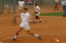 Cat Osterman pitching to the Mean Green.  The Lady Longhorns beat the University of North Texas 5-0 in the first game of the double header Wednesday night.

Filename: SRM_20060308_210011_0.jpg
Aperture: f/6.3
Shutter Speed: 1/20
Body: Canon EOS 20D
Lens: Canon EF 80-200mm f/2.8 L