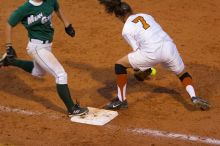 The toss to first baseman Crystal Saenz, #7, is a little too late as the Mean Green runner is safe..  The Lady Longhorns beat the University of North Texas 5-0 in the first game of the double header Wednesday night.

Filename: SRM_20060308_212551_0.jpg
Aperture: f/2.8
Shutter Speed: 1/800
Body: Canon EOS 20D
Lens: Canon EF 80-200mm f/2.8 L