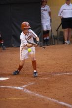 #9, Rachael Cook, bunts against the Mean Green.  The Lady Longhorns beat the University of North Texas 5-0 in the first game of the double header Wednesday night.

Filename: SRM_20060308_211731_8.jpg
Aperture: f/2.8
Shutter Speed: 1/800
Body: Canon EOS 20D
Lens: Canon EF 80-200mm f/2.8 L