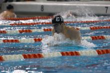 Michael Phelps of the University of Michigan Swim Team placed 1st in the last heat of the 200 IM Finals with a record time of 1:41.30, beating the old record of 1:41.71 at the Speedo American Short Course Championships.

Filename: SRM_20060304_192306_7.jpg
Aperture: f/3.5
Shutter Speed: 1/800
Body: Canon EOS 20D
Lens: Canon EF 80-200mm f/2.8 L