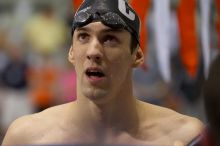 Michael Phelps of the University of Michigan Swim Team placed 1st in the last heat of the 200 IM Finals with a record time of 1:41.30, beating the old record of 1:41.71 at the Speedo American Short Course Championships.

Filename: SRM_20060304_192528_9.jpg
Aperture: f/4.0
Shutter Speed: 1/320
Body: Canon EOS 20D
Lens: Canon EF 80-200mm f/2.8 L