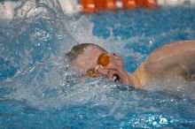Scott Drews of the University of Texas Men's Varsity Swim Team placed 5th in the 1st heat of the 1650 Freestyle Finals with a time of 15:38.65 at the Speedo American Short Course Championships.

Filename: SRM_20060304_185214_8.jpg
Aperture: f/2.8
Shutter Speed: 1/1000
Body: Canon EOS 20D
Lens: Canon EF 80-200mm f/2.8 L