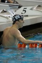 Michael Phelps of the University of Michigan Swim Team placed 1st in the last heat of the 200 IM Finals with a record time of 1:41.30, beating the old record of 1:41.71 at the Speedo American Short Course Championships.

Filename: SRM_20060304_192402_2.jpg
Aperture: f/4.0
Shutter Speed: 1/320
Body: Canon EOS 20D
Lens: Canon EF 80-200mm f/2.8 L