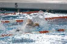 Matthew Lowe of the University of Texas Men's Varsity Swim Team placed 6th in the last heat of the 200 IM Finals with a time of 1:50.02 at the Speedo American Short Course Championships.

Filename: SRM_20060304_192342_3.jpg
Aperture: f/3.5
Shutter Speed: 1/800
Body: Canon EOS 20D
Lens: Canon EF 80-200mm f/2.8 L