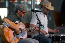 The Gene Pool, performing at the Austin airport.  Geno Stroia II on vocals/guitar, Jorge Castillo on vocals/guitar, Travis Woodard on drums and Steven Ray Will on vocals/bass guitar.

Filename: SRM_20060518_155618_2.jpg
Aperture: f/2.8
Shutter Speed: 1/250
Body: Canon EOS 20D
Lens: Canon EF 80-200mm f/2.8 L