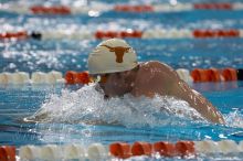 Matthew Lowe of the University of Texas Men's Varsity Swim Team placed 6th in the last heat of the 200 IM Finals with a time of 1:50.02 at the Speedo American Short Course Championships.

Filename: SRM_20060304_192328_7.jpg
Aperture: f/3.5
Shutter Speed: 1/800
Body: Canon EOS 20D
Lens: Canon EF 80-200mm f/2.8 L