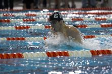 Michael Phelps of the University of Michigan Swim Team placed 1st in the last heat of the 200 IM Finals with a record time of 1:41.30, beating the old record of 1:41.71 at the Speedo American Short Course Championships.

Filename: SRM_20060304_192310_9.jpg
Aperture: f/3.5
Shutter Speed: 1/800
Body: Canon EOS 20D
Lens: Canon EF 80-200mm f/2.8 L