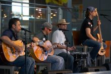 The Gene Pool, performing at the Austin airport.  Geno Stroia II on vocals/guitar, Jorge Castillo on vocals/guitar, Travis Woodard on drums and Steven Ray Will on vocals/bass guitar.

Filename: SRM_20060518_155758_9.jpg
Aperture: f/2.8
Shutter Speed: 1/250
Body: Canon EOS 20D
Lens: Canon EF 80-200mm f/2.8 L