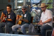 The Gene Pool, performing at the Austin airport.  Geno Stroia II on vocals/guitar, Jorge Castillo on vocals/guitar, Travis Woodard on drums and Steven Ray Will on vocals/bass guitar.

Filename: SRM_20060518_154656_3.jpg
Aperture: f/2.8
Shutter Speed: 1/200
Body: Canon EOS 20D
Lens: Canon EF 80-200mm f/2.8 L