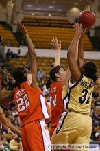 The Georgia Tech women's basketball team played Clemson.

Filename: img_0556_std.jpg
Aperture: f/2.8
Shutter Speed: 1/320
Body: Canon EOS DIGITAL REBEL
Lens: Canon EF 80-200mm f/2.8 L