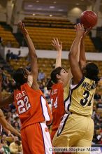 The Georgia Tech women's basketball team played Clemson.

Filename: img_0556_std.jpg
Aperture: f/2.8
Shutter Speed: 1/320
Body: Canon EOS DIGITAL REBEL
Lens: Canon EF 80-200mm f/2.8 L