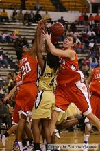 The Georgia Tech women's basketball team played Clemson.

Filename: img_0673_std.jpg
Aperture: f/2.8
Shutter Speed: 1/320
Body: Canon EOS DIGITAL REBEL
Lens: Canon EF 80-200mm f/2.8 L