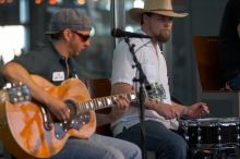 The Gene Pool, performing at the Austin airport.  Geno Stroia II on vocals/guitar, Jorge Castillo on vocals/guitar, Travis Woodard on drums and Steven Ray Will on vocals/bass guitar.

Filename: SRM_20060518_155622_4.jpg
Aperture: f/2.8
Shutter Speed: 1/250
Body: Canon EOS 20D
Lens: Canon EF 80-200mm f/2.8 L