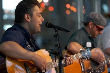 The Gene Pool, performing at the Austin airport.  Geno Stroia II on vocals/guitar, Jorge Castillo on vocals/guitar, Travis Woodard on drums and Steven Ray Will on vocals/bass guitar.

Filename: SRM_20060518_155534_9.jpg
Aperture: f/2.8
Shutter Speed: 1/250
Body: Canon EOS 20D
Lens: Canon EF 80-200mm f/2.8 L