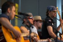 The Gene Pool, performing at the Austin airport.  Geno Stroia II on vocals/guitar, Jorge Castillo on vocals/guitar, Travis Woodard on drums and Steven Ray Will on vocals/bass guitar.

Filename: SRM_20060518_155022_1.jpg
Aperture: f/2.8
Shutter Speed: 1/200
Body: Canon EOS 20D
Lens: Canon EF 80-200mm f/2.8 L