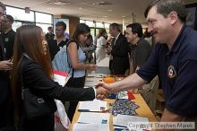 Grace Kwon shakes hands with a representative from the CIA.

Filename: crw_0784_std.jpg
Aperture: f/5.0
Shutter Speed: 1/60
Body: Canon EOS DIGITAL REBEL
Lens: Canon EF-S 18-55mm f/3.5-5.6