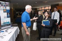 speaks with a recruiter at the career fair.

Filename: crw_0764_std.jpg
Aperture: f/5.0
Shutter Speed: 1/60
Body: Canon EOS DIGITAL REBEL
Lens: Canon EF-S 18-55mm f/3.5-5.6