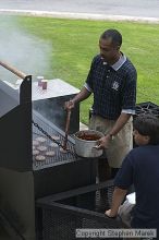 Coach Paul Hewitt and Jimmy Mitchell grill hamburgers at AXO Thursday night.  AXO was the winning sorority for the basketball attendance competition.

Filename: crw_0050_std.jpg
Aperture: f/6.3
Shutter Speed: 1/80
Body: Canon EOS DIGITAL REBEL
Lens: Canon EF 50mm f/1.8 II