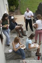 Coach Paul Hewitt talks to AXO sisters after grilling out Thursday night.  AXO was the winning sorority for the basketball attendance competition.

Filename: crw_0064_std.jpg
Aperture: f/6.3
Shutter Speed: 1/60
Body: Canon EOS DIGITAL REBEL
Lens: Sigma 15-30mm f/3.5-4.5 EX Aspherical DG DF