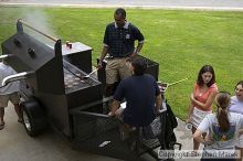 Coach Paul Hewitt grills hamburgers as AXO sisters watch Thursday night.  AXO was the winning sorority for the basketball attendance competition.

Filename: crw_0048_std.jpg
Aperture: f/6.3
Shutter Speed: 1/80
Body: Canon EOS DIGITAL REBEL
Lens: Sigma 15-30mm f/3.5-4.5 EX Aspherical DG DF