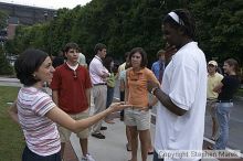 Suzannah Gill, Casey Taylor and Clarence Moore have a conversation after Coach Hewitt's cookout at AXO.  AXO was the winning sorority for the basketball attendance competition.

Filename: crw_0095_std.jpg
Aperture: f/6.3
Shutter Speed: 1/80
Body: Canon EOS DIGITAL REBEL
Lens: Sigma 15-30mm f/3.5-4.5 EX Aspherical DG DF