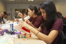 Emily Ng, right, decorates her mask next to Vivian Mai-Tran, left, at a domestic violence expressive arts workshop for survivors and friends of survivors of domestic and relationship violence.
Filename: SRM_20061023_1738546.jpg
Aperture: f/5.6
Shutter Speed: 1/100
Body: Canon EOS 20D
Lens: Canon EF-S 18-55mm f/3.5-5.6