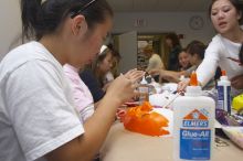 Hannah Yee painting her mask at a domestic violence expressive arts workshop for survivors and friends of survivors of domestic and relationship violence.
Filename: SRM_20061023_1741062.jpg
Aperture: f/5.6
Shutter Speed: 1/100
Body: Canon EOS 20D
Lens: Canon EF-S 18-55mm f/3.5-5.6