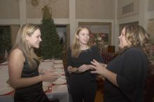Jessica Iselt, Carol Gosset, and Katie Crane (from lefet) enjoy cocktails before the Alpha Xi Delta Christmas dinner, Friday, December 4, 2006.

Filename: SRM_20061204_1739469.jpg
Aperture: f/5.0
Shutter Speed: 1/250
Body: Canon EOS 20D
Lens: Canon EF-S 18-55mm f/3.5-5.6