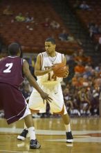 Guard D.J. Augustin, #14.  The longhorns defeated the Texas Southern University (TSU) Tigers 90-50 Tuesday night.

Filename: SRM_20061128_2045481.jpg
Aperture: f/2.8
Shutter Speed: 1/640
Body: Canon EOS-1D Mark II
Lens: Canon EF 80-200mm f/2.8 L