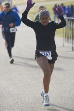 Venus Dever, 1:40:07, dancing across the finish at Decker Challenge 20K 2006 road race.

Filename: SRM_20061203_0944086.jpg
Aperture: f/4.0
Shutter Speed: 1/800
Body: Canon EOS-1D Mark II
Lens: Canon EF 80-200mm f/2.8 L