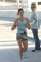 Sarah Shuler, bib #1316, places first for the women with a time of 1:02:45 at The Girl Scout Scenic 10 Miler road race, Sunday, October 22, 2006.

Filename: SRM_20061022_0857366.jpg
Aperture: f/6.3
Shutter Speed: 1/250
Body: Canon EOS 20D
Lens: Canon EF 80-200mm f/2.8 L