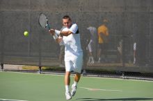 Texas' Dimitar Kutrovsky defeated Tech's Jose Muguruza 6-2 and 6-3.  The University of Texas (UT) men's tennis team defeated Georgia Tech (GT) Saturday, February 24, 2007..

Filename: SRM_20070224_1455222.jpg
Aperture: f/4.0
Shutter Speed: 1/4000
Body: Canon EOS-1D Mark II
Lens: Canon EF 80-200mm f/2.8 L