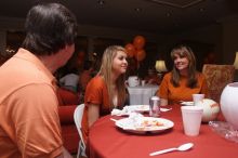 Tahnae Tarkenton eats lunch with her parents.  Kappa Kappa Gamma (KKG) hosted a parents' weekend barbecue before the UT vs Nebraska football game on Saturday, October 27, 2007 at their sorority house.

Filename: SRM_20071027_1137048.jpg
Aperture: f/8.0
Shutter Speed: 1/100
Body: Canon EOS 20D
Lens: Canon EF-S 18-55mm f/3.5-5.6