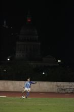 UT senior Dianna Pfenninger (#8, Goalkeeper) takes a goal kick with the capitol in the background.  The University of Texas women's soccer team tied 0-0 against the Texas A&M Aggies Friday night, September 27, 2008.

Filename: SRM_20080926_2050187.jpg
Aperture: f/2.8
Shutter Speed: 1/500
Body: Canon EOS-1D Mark II
Lens: Canon EF 300mm f/2.8 L IS
