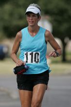 Karen Pearce placed second in her age groun at the Army Dillo half-marathon and 32K race.

Filename: SRM_20080921_1056468.jpg
Aperture: f/4.0
Shutter Speed: 1/2500
Body: Canon EOS-1D Mark II
Lens: Canon EF 300mm f/2.8 L IS