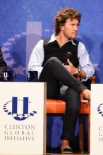 Blake Mycoskie, founder of TOMS shoes, donates one pair of shoes to a third world country for every pair of shoes they sell.  Day one of the 2nd Annual Clinton Global Initiative University (CGIU) meeting was held at The University of Texas at Austin, Friday, February 13, 2009.
Filename: SRM_20090213_17393543.jpg
Aperture: f/5.6
Shutter Speed: 1/125
Body: Canon EOS 20D
Lens: Canon EF 300mm f/2.8 L IS
