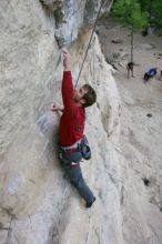 Me top rope climbing Diving for Rocks (5.10d), photographed from  the third bolt of Magster (5.10a) by Andrew Dreher.  It was another long day of rock climbing at Seismic Wall on Austin's Barton Creek Greenbelt, Saturday, April 11, 2009.

Filename: SRM_20090411_17100845.JPG
Aperture: f/5.6
Shutter Speed: 1/320
Body: Canon EOS-1D Mark II
Lens: Canon EF 16-35mm f/2.8 L