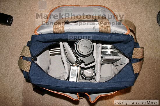 Top down view; camera body (with 18-55mm lens) fits in the left side, extra hole for a new lens on the right....top center is canon 80-200mm f/2.8 lens....top right is pack of closeup filters (52mm), gossen pilot 2 light meter, extra rear EF lens cap and body EF cap, polarizing filter (62mm), step down rings (62->52mm and 55->52mm)....bottom middle is vivitar 2000 flash and canon 50mm f/1.4 lens..xdrive should fit there too

Filename: img_5615_std.jpg
Aperture: f/5.6
Shutter Speed: 1/60
Body: Canon EOS DIGITAL REBEL
Lens: Canon EF-S 18-55mm f/3.5-5.6